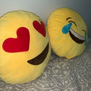 Two emoji pillows